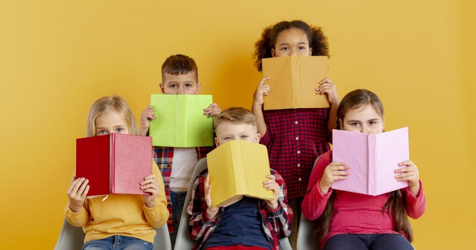 childrens covering faces withbooks