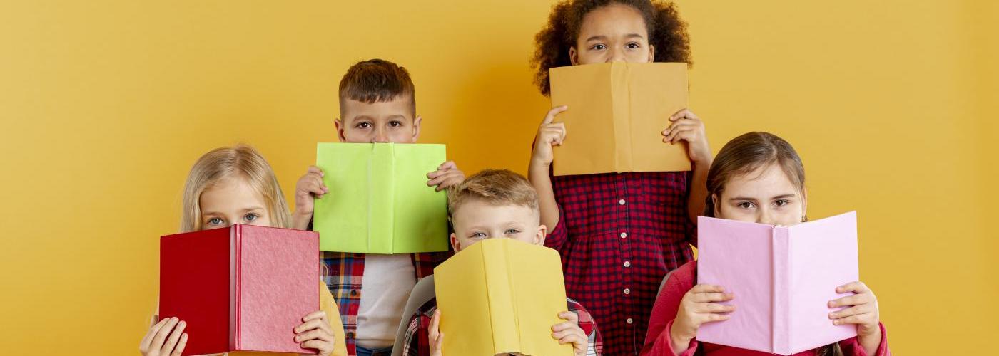 childrens covering faces withbooks